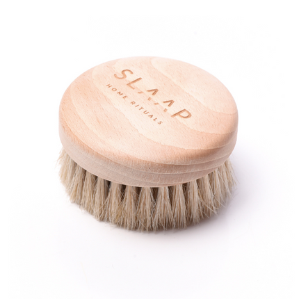 A brush for massaging the bust, neck and décolleté