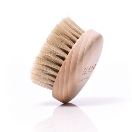 A brush for massaging the bust, neck and décolleté