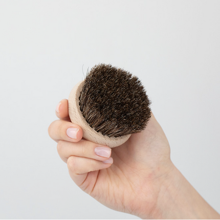 A brush for massaging the bust, neck and décolleté